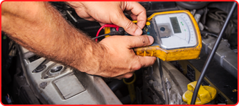 Man Working on a Car's Electrical  System in Des Plaines, IL